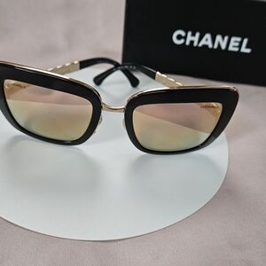 CHANEL Black and Gold Cat Eye Sunglasses with Gradient Pink-Gold Lenses